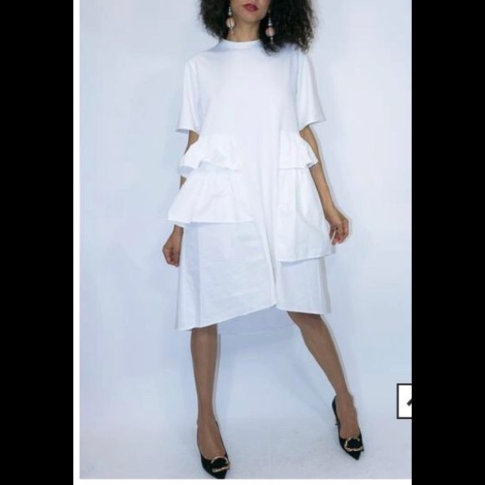 White gorgeous dress with oversize pockets